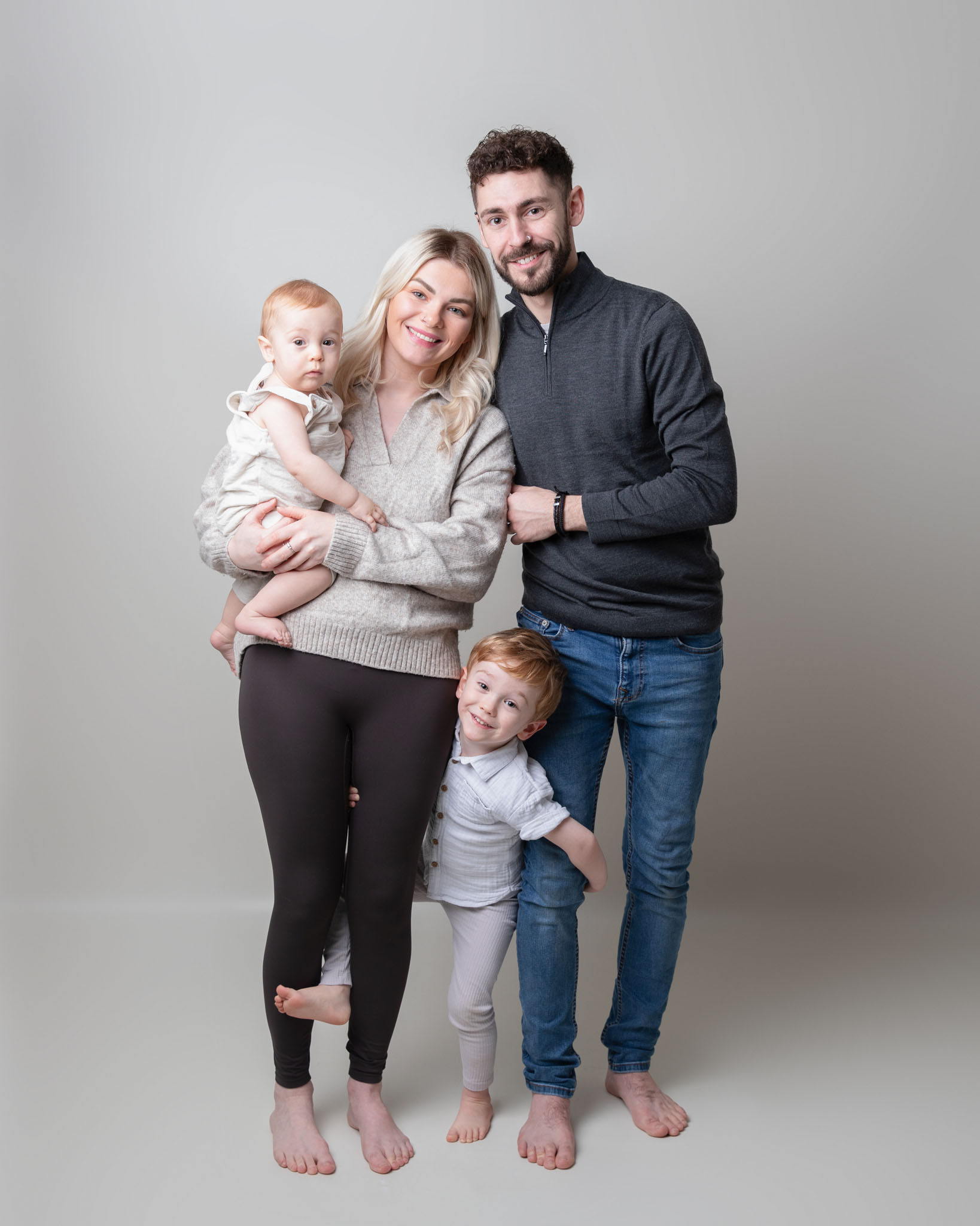 Family with two parents and two children by Family photography in Wiltshire, Somerset and Bath